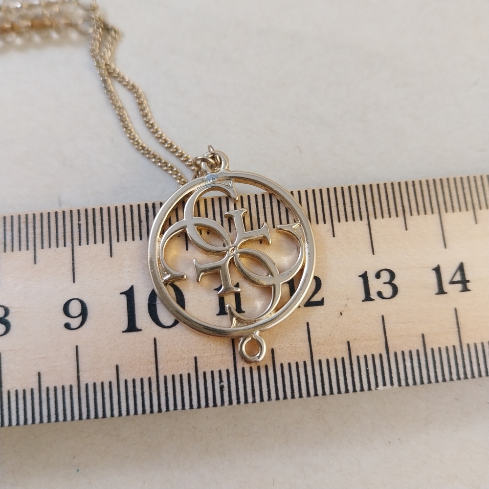 Guess Gold and Crystal Pendant Necklace - Picture 10 of 13